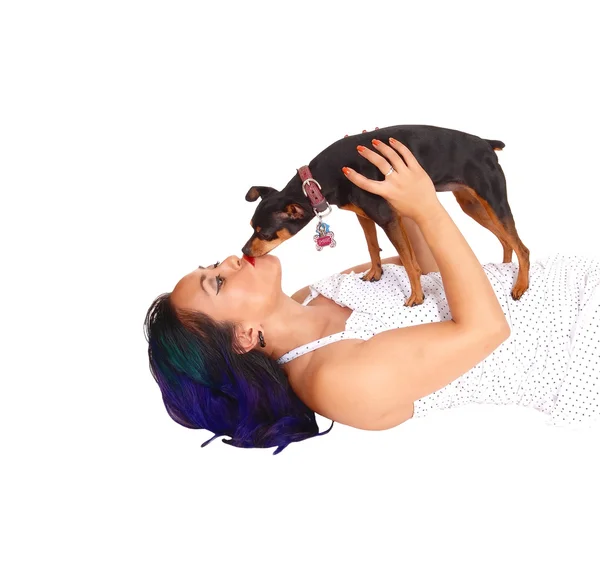 Woman kissing her dog. — Stock Photo, Image