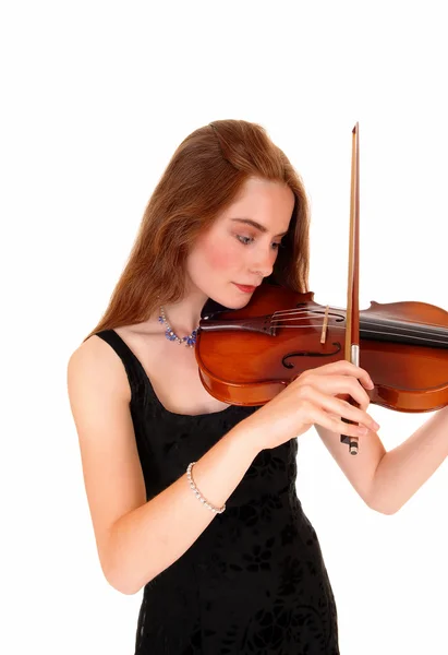 Woman playing the violin. Stock Photo