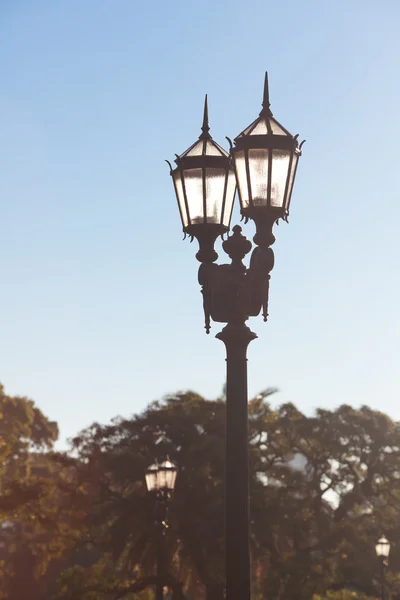 Two old lanterns against the blue sky — Stock Photo, Image