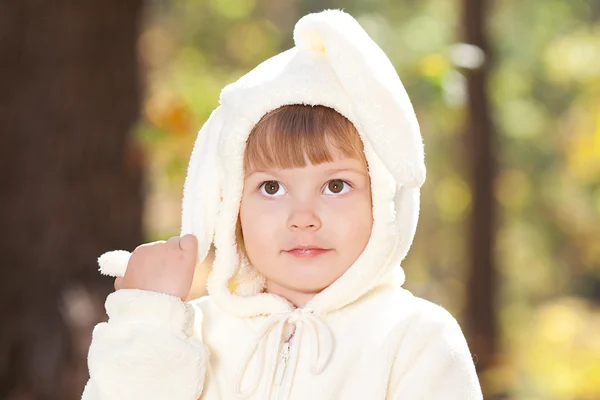 Beautiful little girl in costume bunny in the autumn forest — Stock Photo, Image