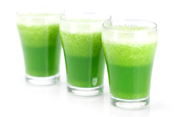 Three glasses with celery juice isolated on white — Stock Photo, Image