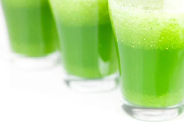 Three glasses with celery juice isolated on white — Stock Photo, Image