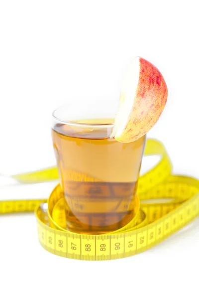 Measuring tape,apples and glass of apple juice isolated on white — Stock Photo, Image