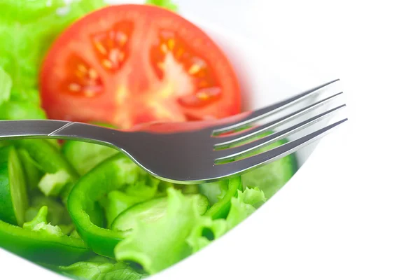 Fork,lettuce, tomato, cucumber and pepper in a bowl isolated on — Stock Photo, Image