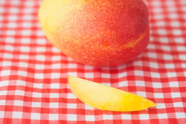 Mango fruit on checkered fabric — Stock Photo, Image