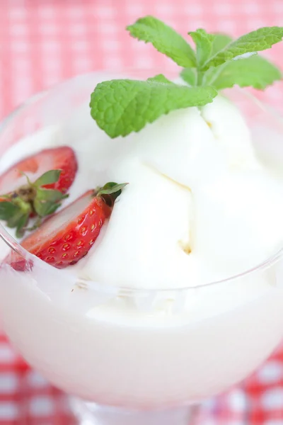 Ice cream with mint in a glass bowl and strawberry on plaid fabr — Stock Photo, Image