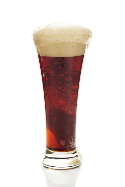 Dark beer with the foam in a tall glass isolated on white — Stock Photo, Image