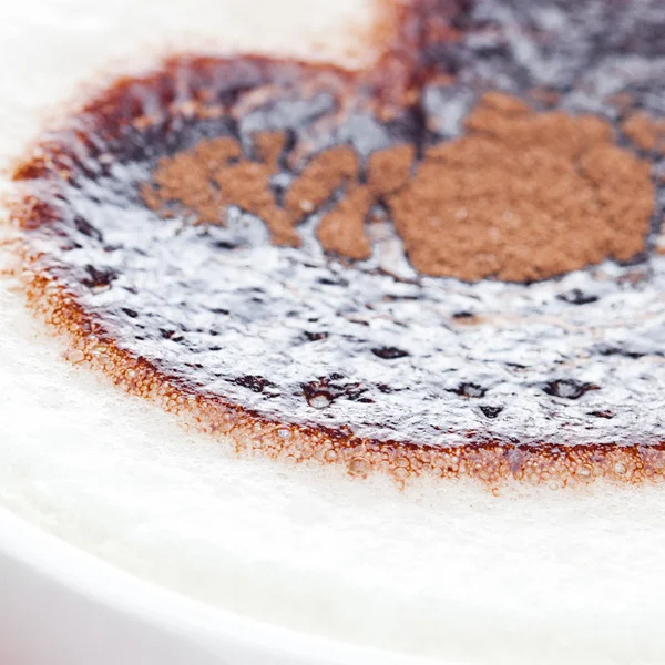 Cappuccino in a cup in the shape of heart — Stock Photo, Image