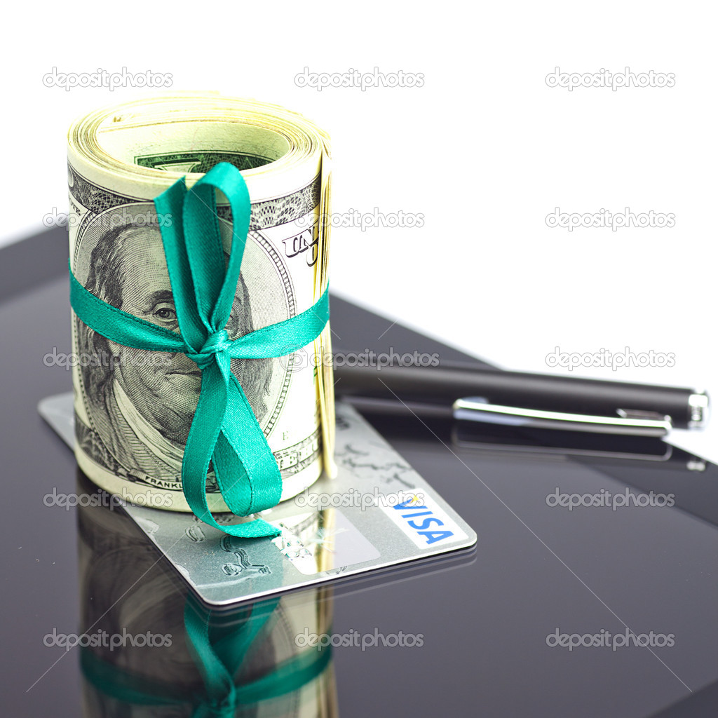 tablet,tube of dollars,credit card and stylus isolated on white