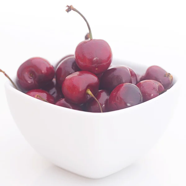 Cherries in a ceramic bowl isolated on white — Stock Photo, Image
