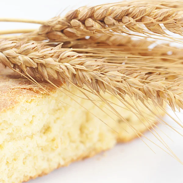 Bread and spikes isolated on white — Stock Photo, Image