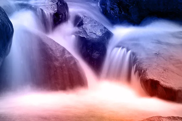Landscape with a waterfall in a sum — Stock Photo, Image