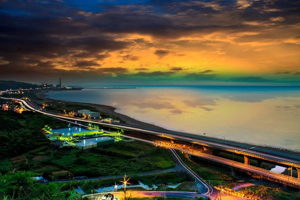 Sunset landscape with coastal road — Stock Photo, Image