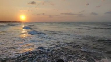 Sea sunset,sea landscape,sea water surface lit by sunset summer light