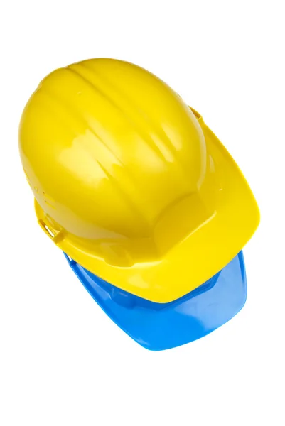 Yellow and blue helmets — Stock Photo, Image