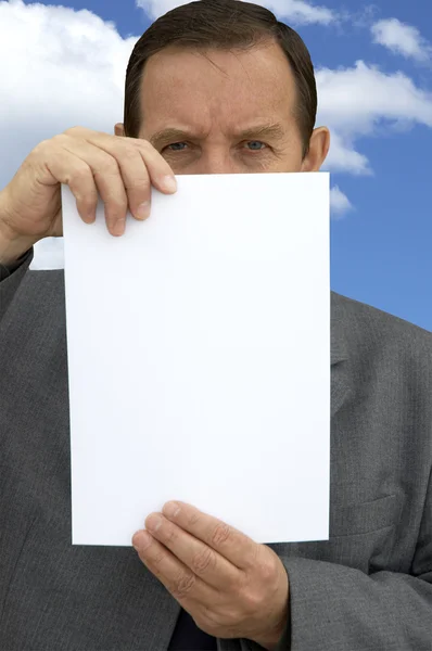 Senior businessman with blank sheet — Stock Photo, Image