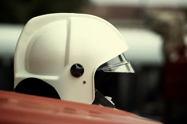 Hard hat on the fire-engine — Stock Photo, Image