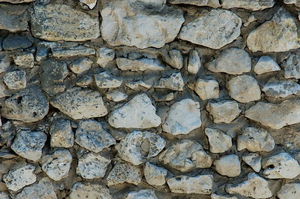 Старая стена из натуральных камней — стоковое фото