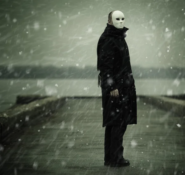 Man with white mask near the river — Stock Photo, Image