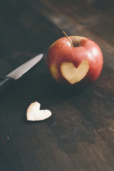 Apple with a heart cut into it — Stock Photo, Image