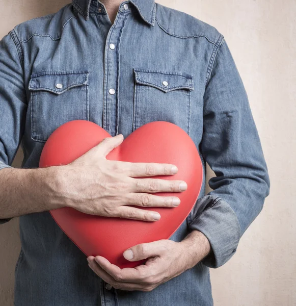 Man with big red heart — Stock Photo, Image