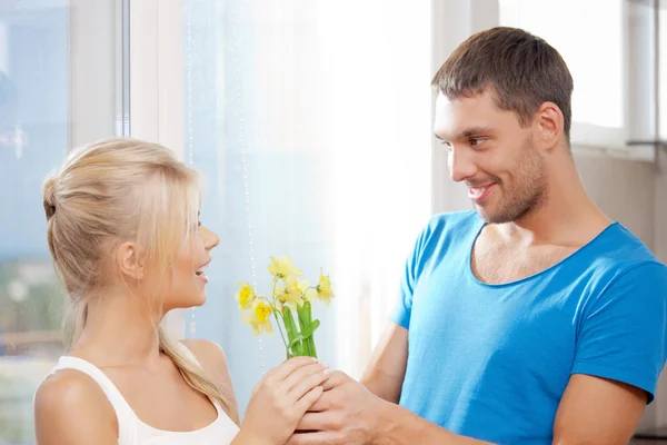 Romantic couple with flowers — Stock Photo, Image