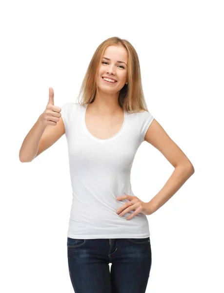 十几岁的女孩在与竖起大拇指的空白白色 t 恤 图库图片