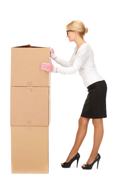 Businesswoman with big boxes — Stock Photo, Image