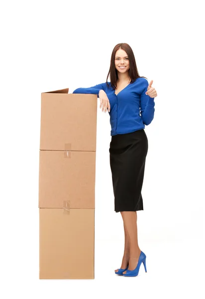 Businesswoman with big boxes — Stock Photo, Image