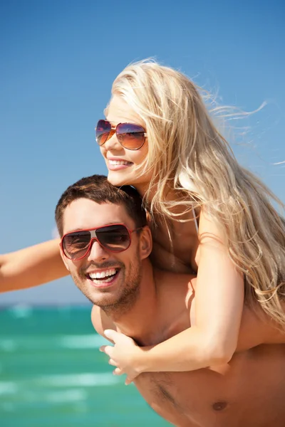 Happy couple in sunglasses on the beach Stock Photo