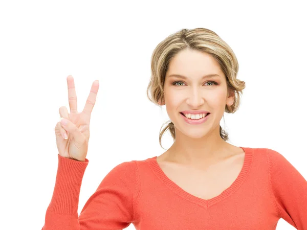 Young woman showing victory sign Stock Picture