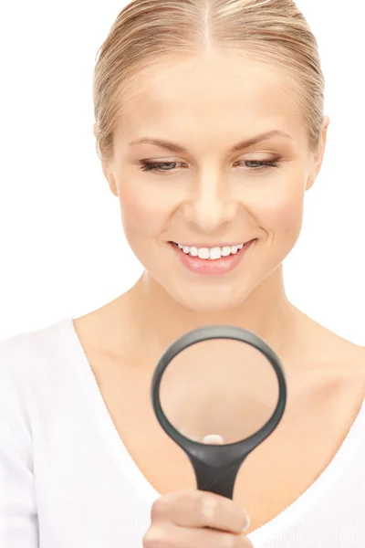 Woman with magnifying glass Royalty Free Stock Photos