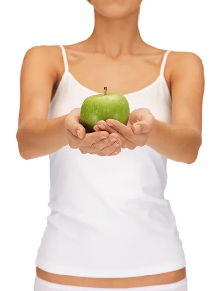 Female hands with green apple — Stock Photo, Image