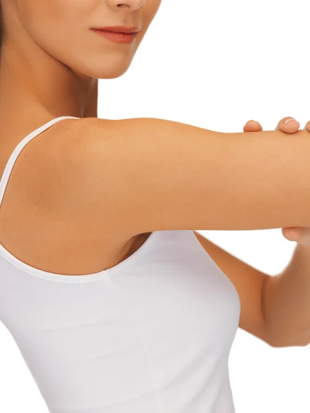 Sporty woman flexing her biceps — Stock Photo, Image