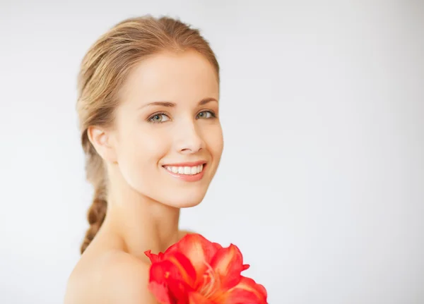 Lovely woman with lily flower — Stock Photo, Image
