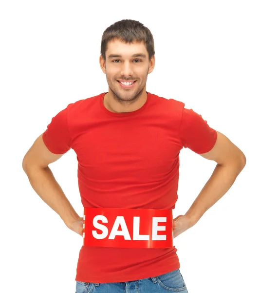 Handsome man with sale sign — Stock Photo, Image