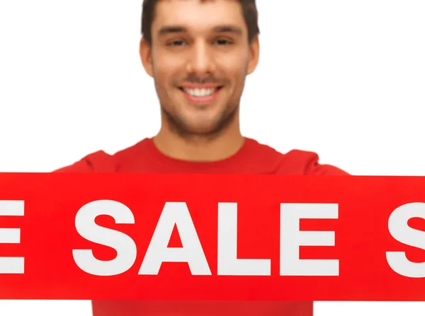 Pohledný muž s nápis-na prodej — Stock fotografie