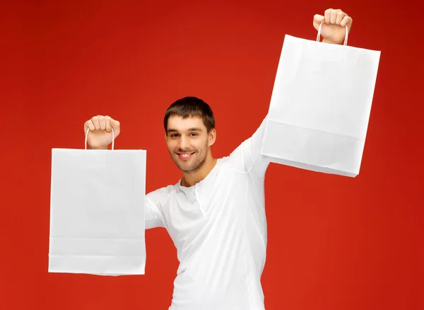 Hombre con bolsas de compras —  Fotos de Stock