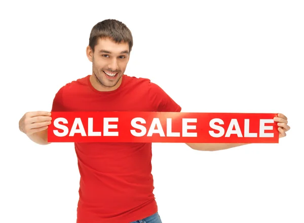 Handsome man with sale sign — Stock Photo, Image