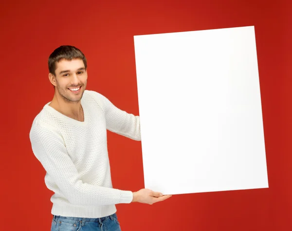 Homem bonito com grande placa em branco — Fotografia de Stock