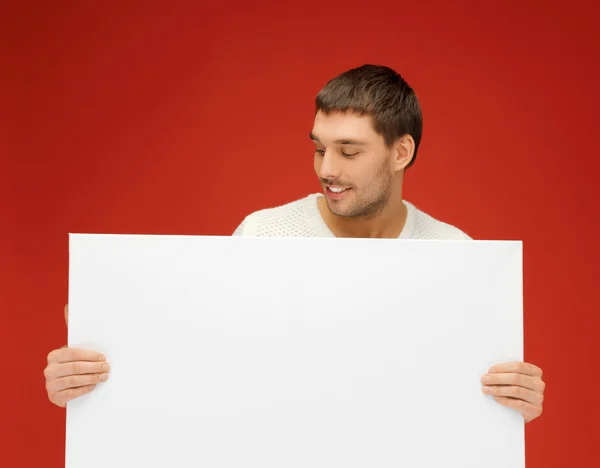 Homem bonito com grande placa em branco — Fotografia de Stock