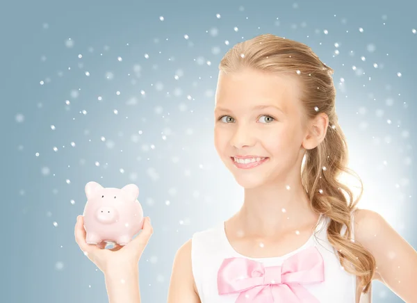 Lovely teenage girl with piggy bank — Stock Photo, Image