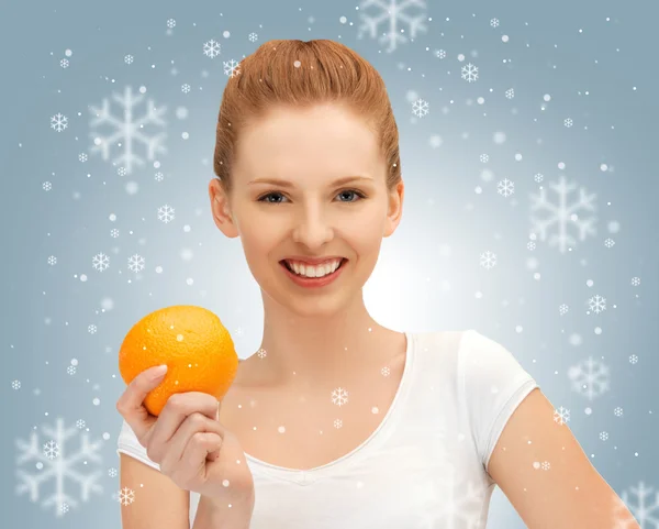 Teenage girl with orange — Stock Photo, Image