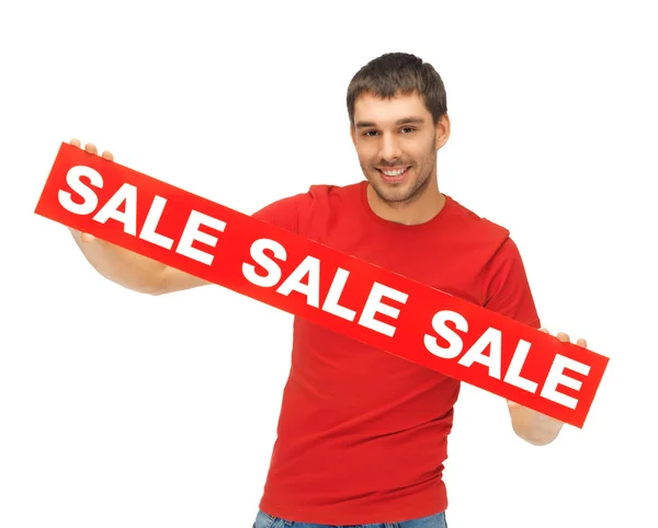 Yakışıklı erkek ile satışı işareti — Stok fotoğraf
