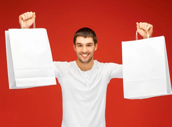 Hombre con bolsas de compras — Foto de Stock