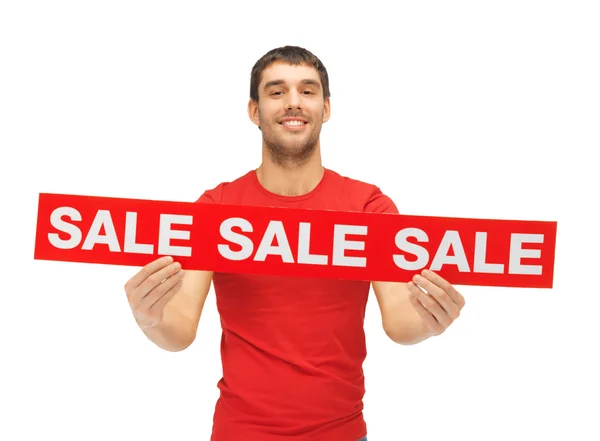 Handsome man with sale sign — Stock Photo, Image