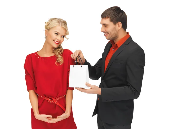 Man and woman with present — Stock Photo, Image