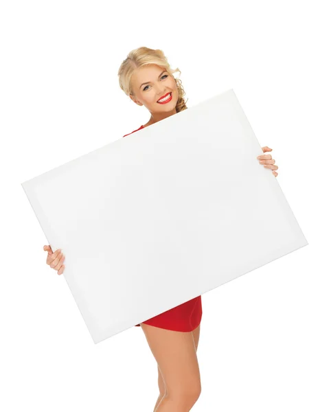 Lovely woman in red dress with blank board — Stock Photo, Image