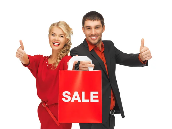 Hombre y mujer con bolsa de compras — Foto de Stock