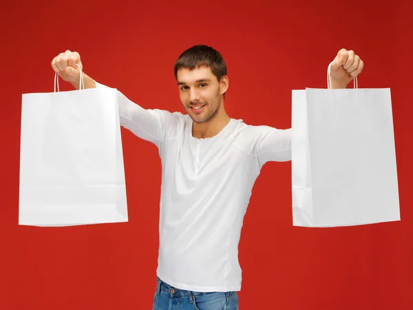 Homem com sacos de compras — Fotografia de Stock